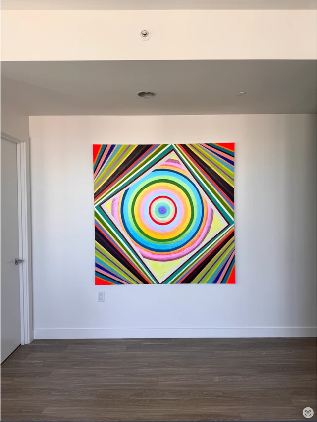 20-24 in its interior: a colourful geometric painting on the wall, with the full room photograph visible.